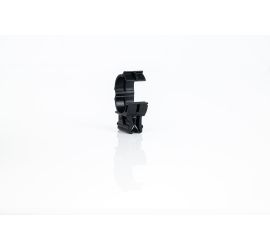 A black KC22 edge clip for corrugated tubing with the plastic clip in right angle on top of the clip, on a white background. The plastic clip has been opened.