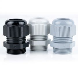 Three plastic (polyamide PA6 V-2) Jacob cable glands (metric) in Gray, white and black on a white background.
