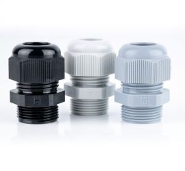 Three plastic (polyamide PA6 V-2) Jacob cable glands (Pg) in gray, white and black on a white background.
