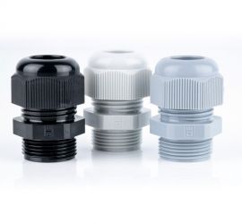 Three plastic (polyamide PA6 V-2) Jacob cable glands (Pg) in gray, white and black on a white background.
