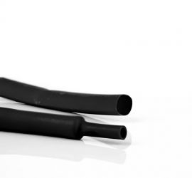 Two black H-2(HF) thin-wall polyolefin heat shrink tubes next to each other, one in the original size, and one with the end part shrinked.