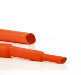 Two orange HBTM busbar insulation tubes, one in the original size, and one shrunk to two different sizes.