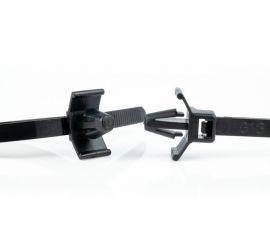Two black plastic push mount cable ties, type 1. One is pictured from the front, one is pictured from the side.