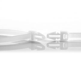Two natural colored plastic push mount cable ties, type 2. One is closed, and of one the head of the cable tie has been enlarged.