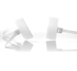 Two natural colored plastic marker cable ties, with the label above the head of the cable tie, of which one loose, and one bound.