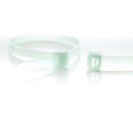 A heat-resistant plastic cable tie in the color natural, next to the enlarged head of another natural colored cable tie.