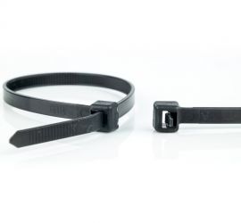 A releasable black plastic cable tie, next to the enlarged head of another black releasable cable tie.