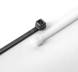 A natural colored and a black plastic cable tie on a white background.