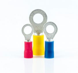 A red, a yellow and a blue insulated ring terminal, without sleeve standing upright, on a white background.