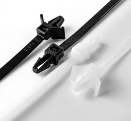 Two natural colored and two black push mount cable ties, in two versions, on a white background.